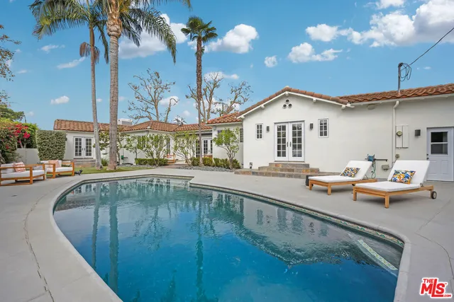 a view of a swimming pool with a patio