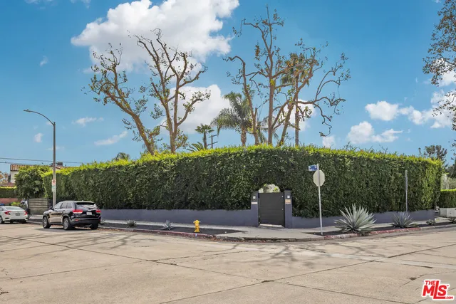 a view of a car park in front of a building