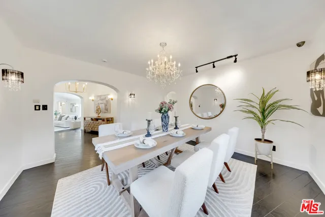 a living room with dining table and chairs