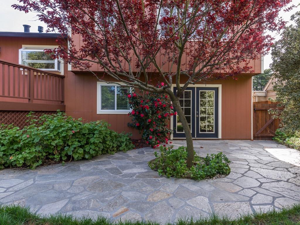 571 Lancaster Boulevard Moss Beach, CA 94038 - Photo 12 of 16 a front view of a house with garden
