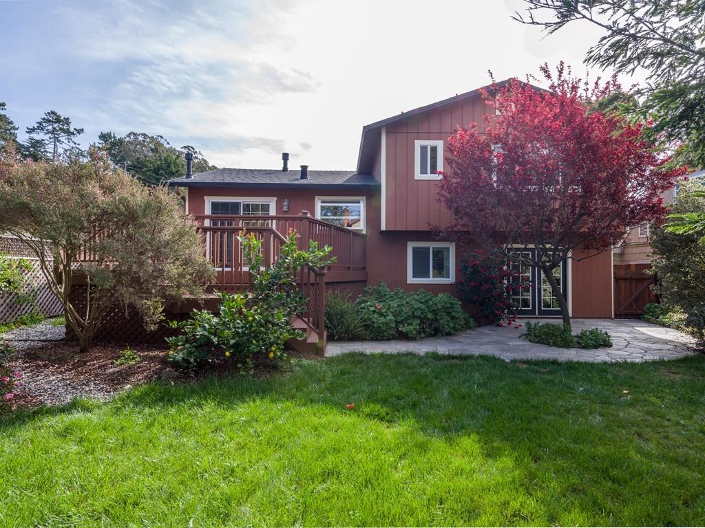 571 Lancaster Boulevard Moss Beach, CA 94038 - Photo 14 of 16 a view of a brick house with a yard and plants