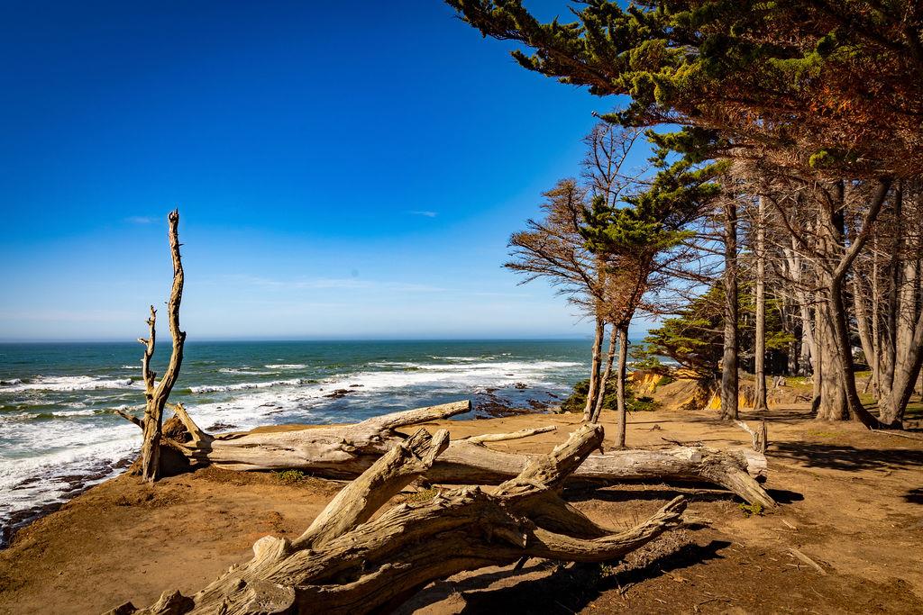571 Lancaster Boulevard Moss Beach, CA 94038 - Photo 15 of 16 a view of a lake with a table and chairs