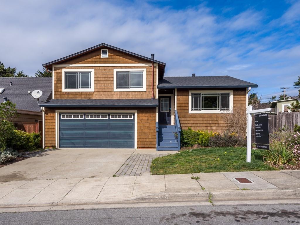 571 Lancaster Boulevard Moss Beach, CA 94038 - Photo 2 of 16 a front view of a house with a garden