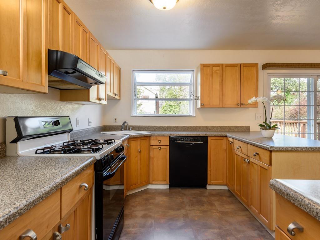 571 Lancaster Boulevard Moss Beach, CA 94038 - Photo 4 of 16 a kitchen with stainless steel appliances granite countertop a sink stove and refrigerator