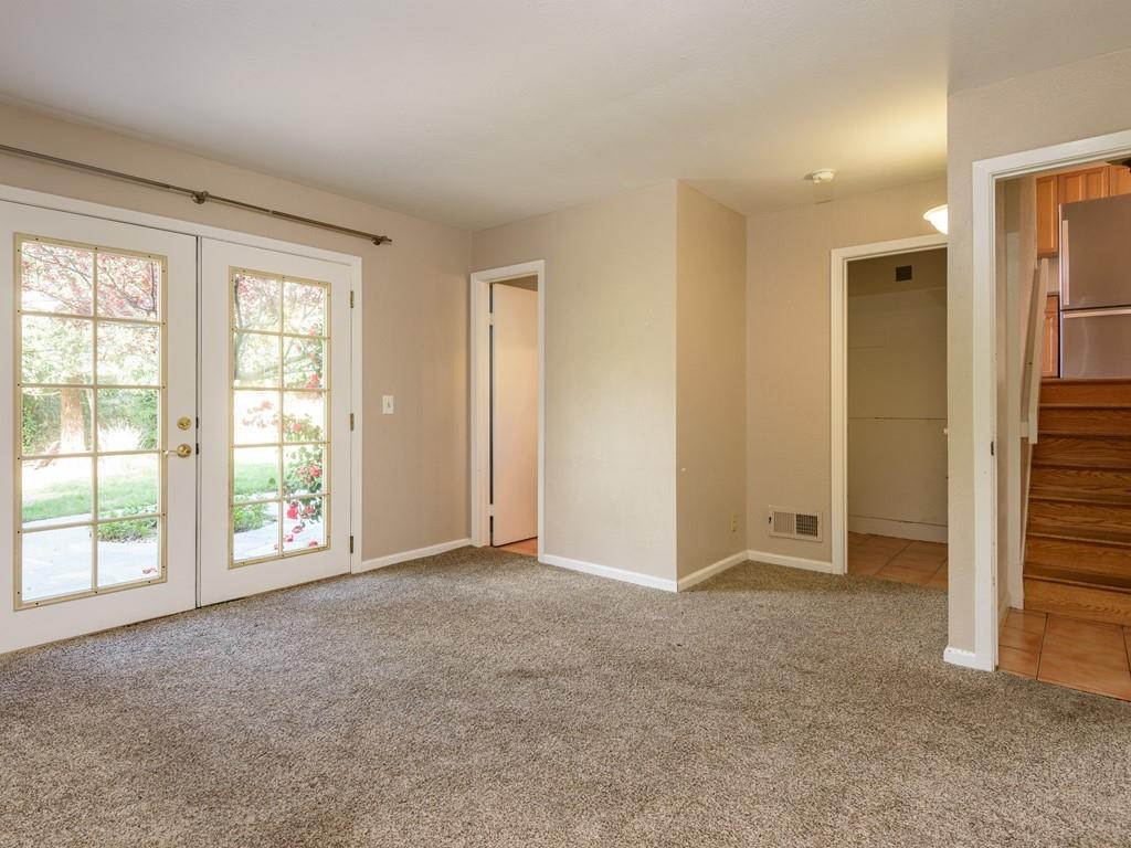 571 Lancaster Boulevard Moss Beach, CA 94038 - Photo 9 of 16 an empty room with windows and closet