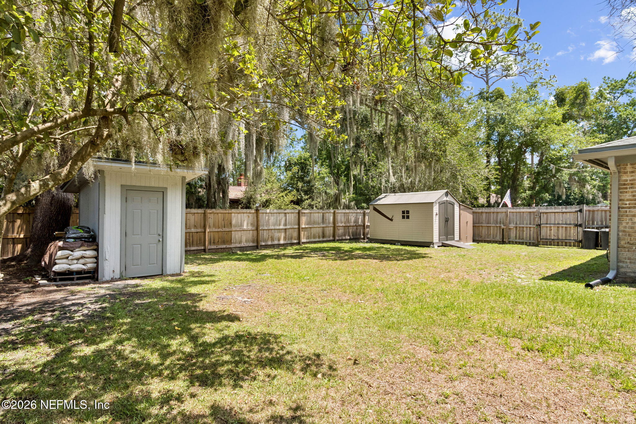 3194 Creighton Landing Road Fleming Island, FL 32003 - Photo 28 of 31 a view of a house with a yard and garage