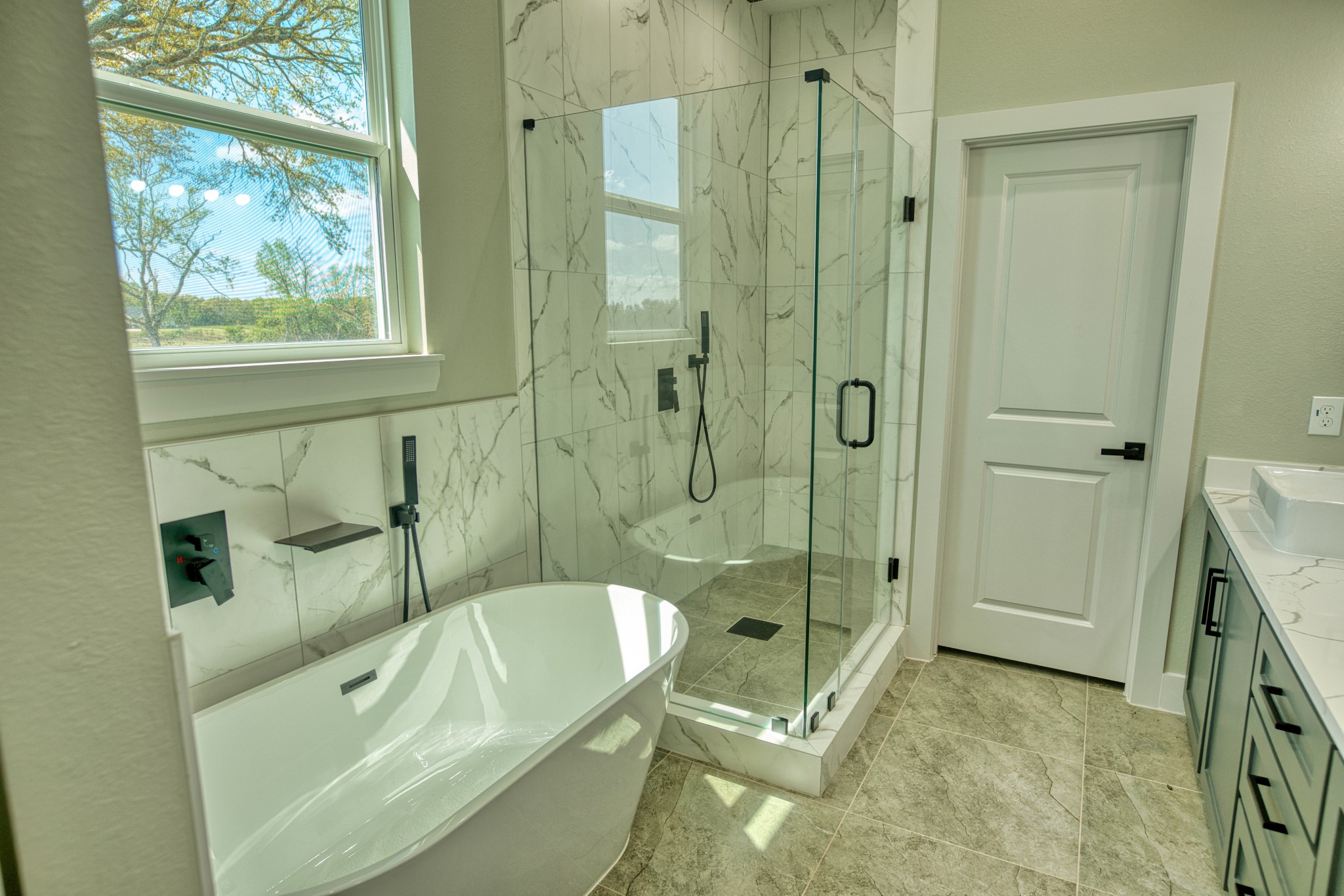 925 Buffalo Trail Angleton, TX 77515 - Photo 30 of 45 a bathroom with a tub a toilet and a shower