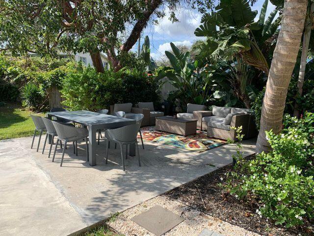 640 Southeast 2nd Avenue, Unit 202 Boynton Beach, FL 33435 - Photo 20 of 21 a view of a dinning table and chairs in the patio