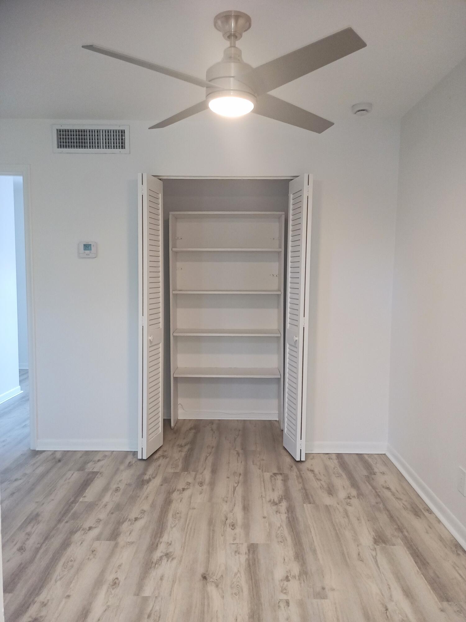 640 Southeast 2nd Avenue, Unit 202 Boynton Beach, FL 33435 - Photo 7 of 21 a view of a room with a ceiling fan