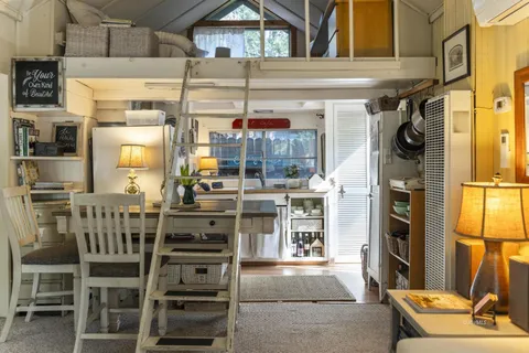 a view of a kitchen with furniture and a window