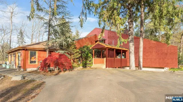 a view of a house with snow on the road