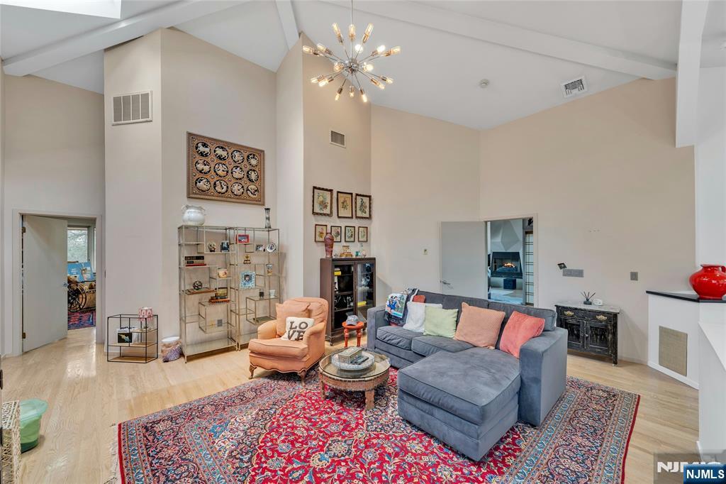 262 West Saddle River Road Upper Saddle River, NJ 07458 - Photo 12 of 24 a living room with furniture and a chandelier