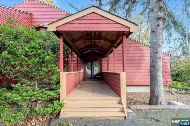 a front view of a house with a porch