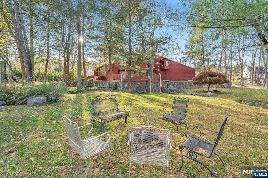 262 West Saddle River Road Upper Saddle River, NJ 07458 - Photo 21 of 24 a view of swimming pool with outdoor seating and yard in the back