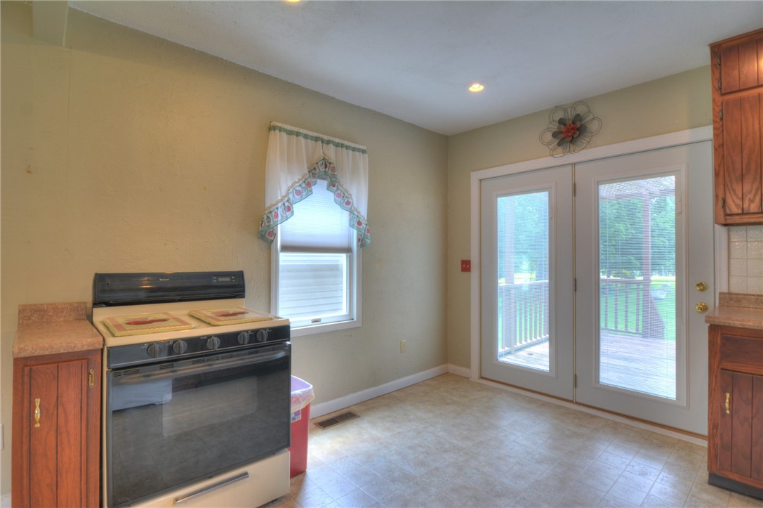 63 Grays Lane Decatur, IL 62526 - Photo 13 of 28 a kitchen with a stove and a cabinet