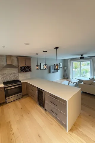 a kitchen with counter top space and stainless steel appliances