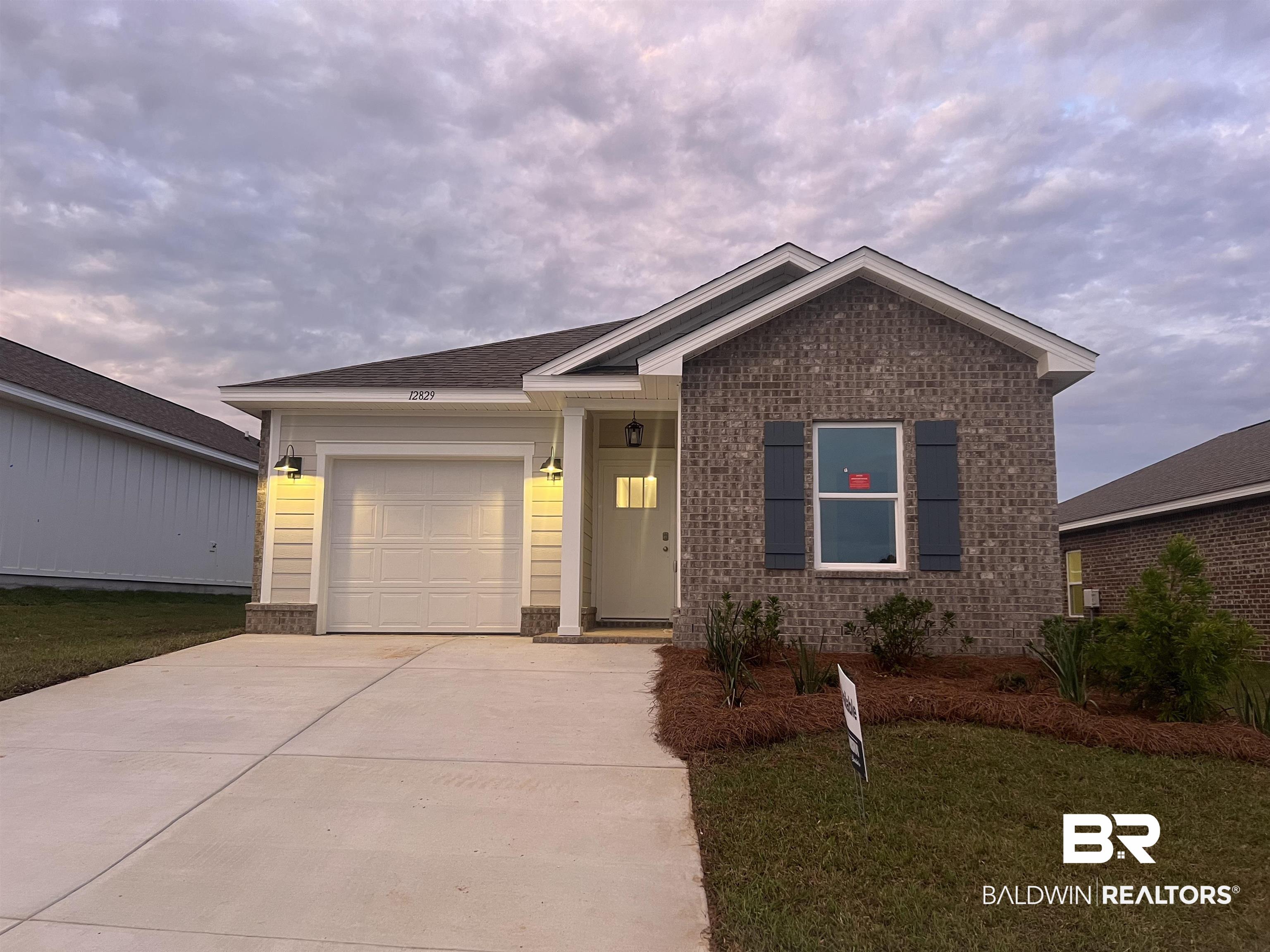 12829 Patriot Way Daphne, AL 36527 - Photo 2 of 38 View of front of house with a garage and a front yard