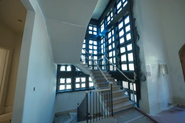 a view of an empty room and a window