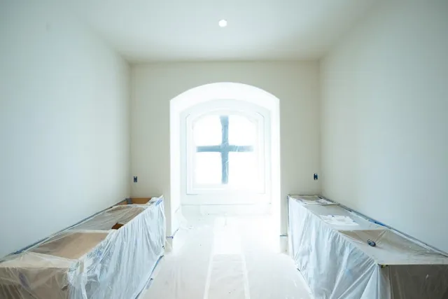 a view of an empty room with a window