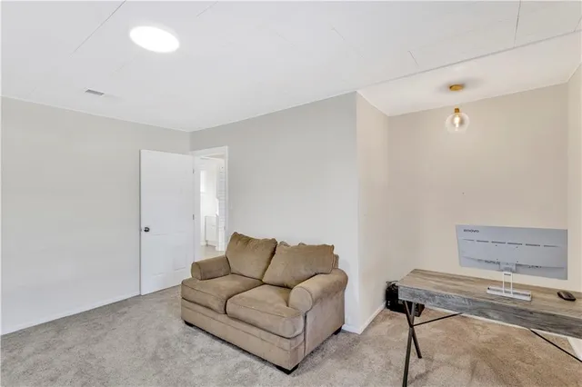 a living room with furniture and a table