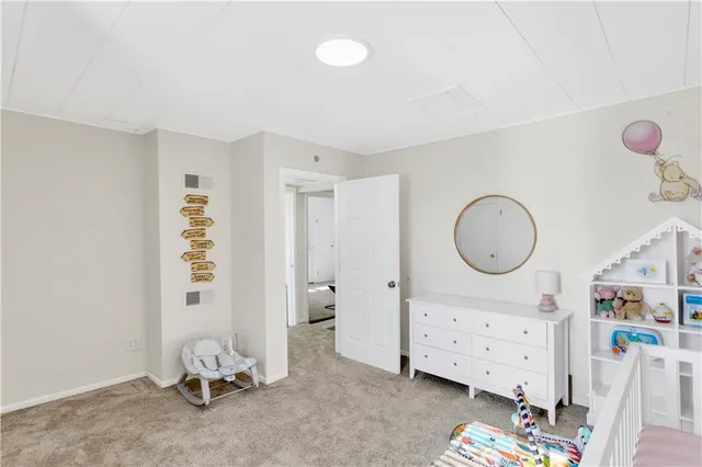 a view of a bedroom with baby toys