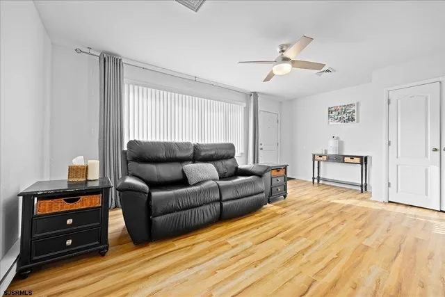 a living room with furniture and a window