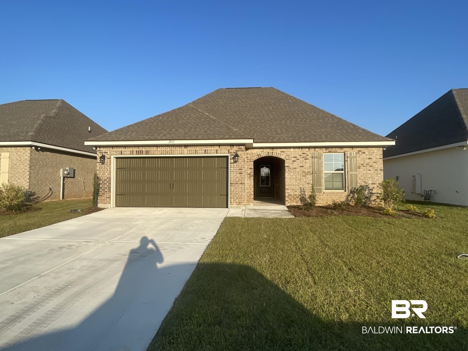 1573 Fenton Circle Foley, AL 36535 - Photo 1 of 3 Ranch-style home with a front lawn and a garage
