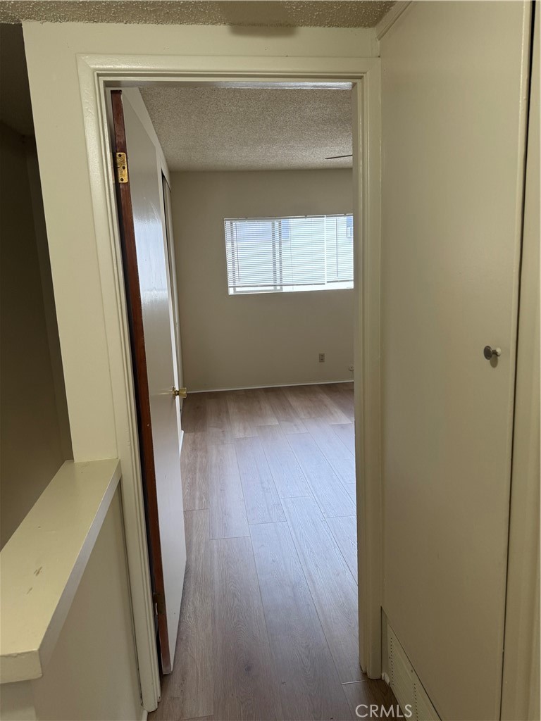 936 West Duarte Road, Unit C Arcadia, CA 91007 - Photo 13 of 29 a view of an empty room with wooden floor and a window