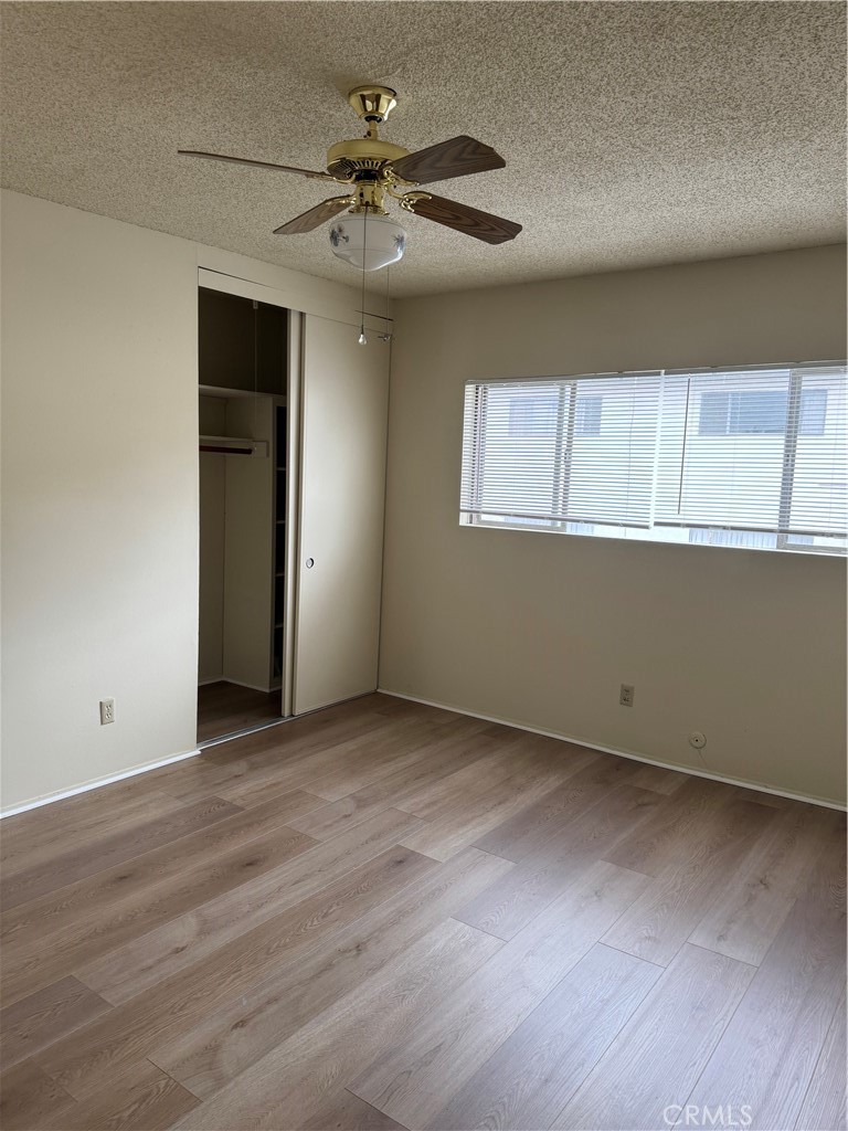 936 West Duarte Road, Unit C Arcadia, CA 91007 - Photo 15 of 29 a view of an empty room with a window and wooden floor