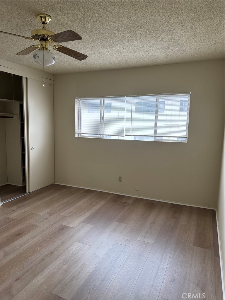 936 West Duarte Road, Unit C Arcadia, CA 91007 - Photo 16 of 29 an empty room with wooden floor and windows