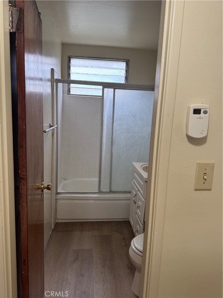 936 West Duarte Road, Unit C Arcadia, CA 91007 - Photo 23 of 29 a bathroom with a granite countertop shower and a toilet