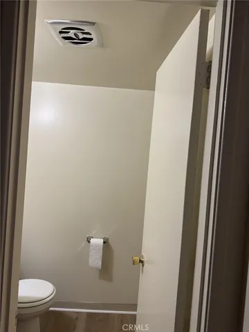 a bathroom with a toilet a sink and a vanity