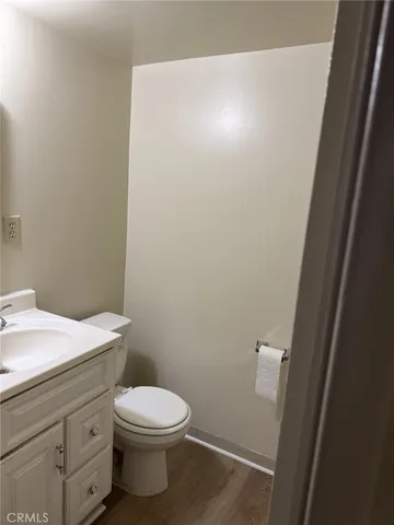 a white toilet sitting next to a bathroom sink
