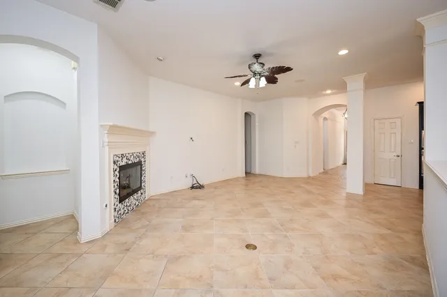 a view of an empty room with a fireplace