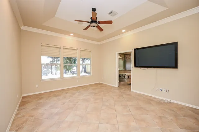 a view of a livingroom with furniture and a window