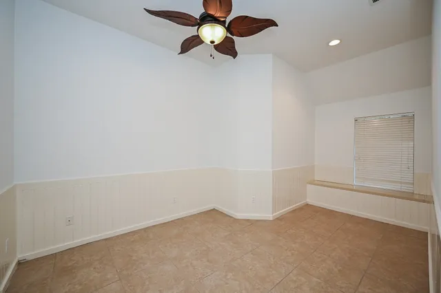 a view of an empty room with a cabinet