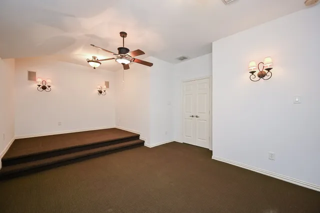 a view of a brick house with a large window