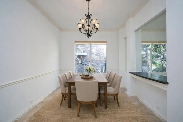 en empty room with windows and a ceiling fan