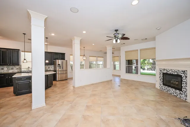 a kitchen with stainless steel appliances granite countertop a sink stove and microwave
