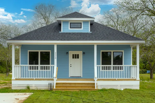 a front view of a house with a porch