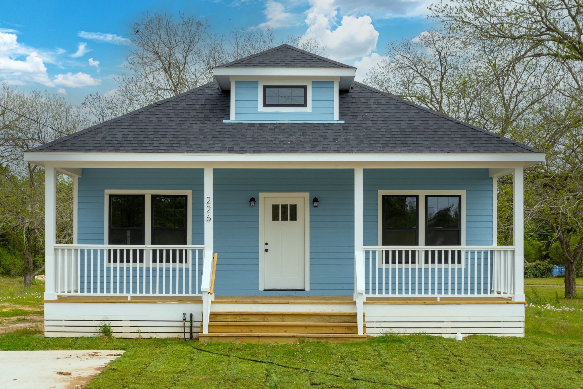 a front view of a house with a porch