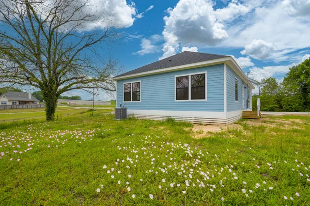 a backyard of a house with lots of green space