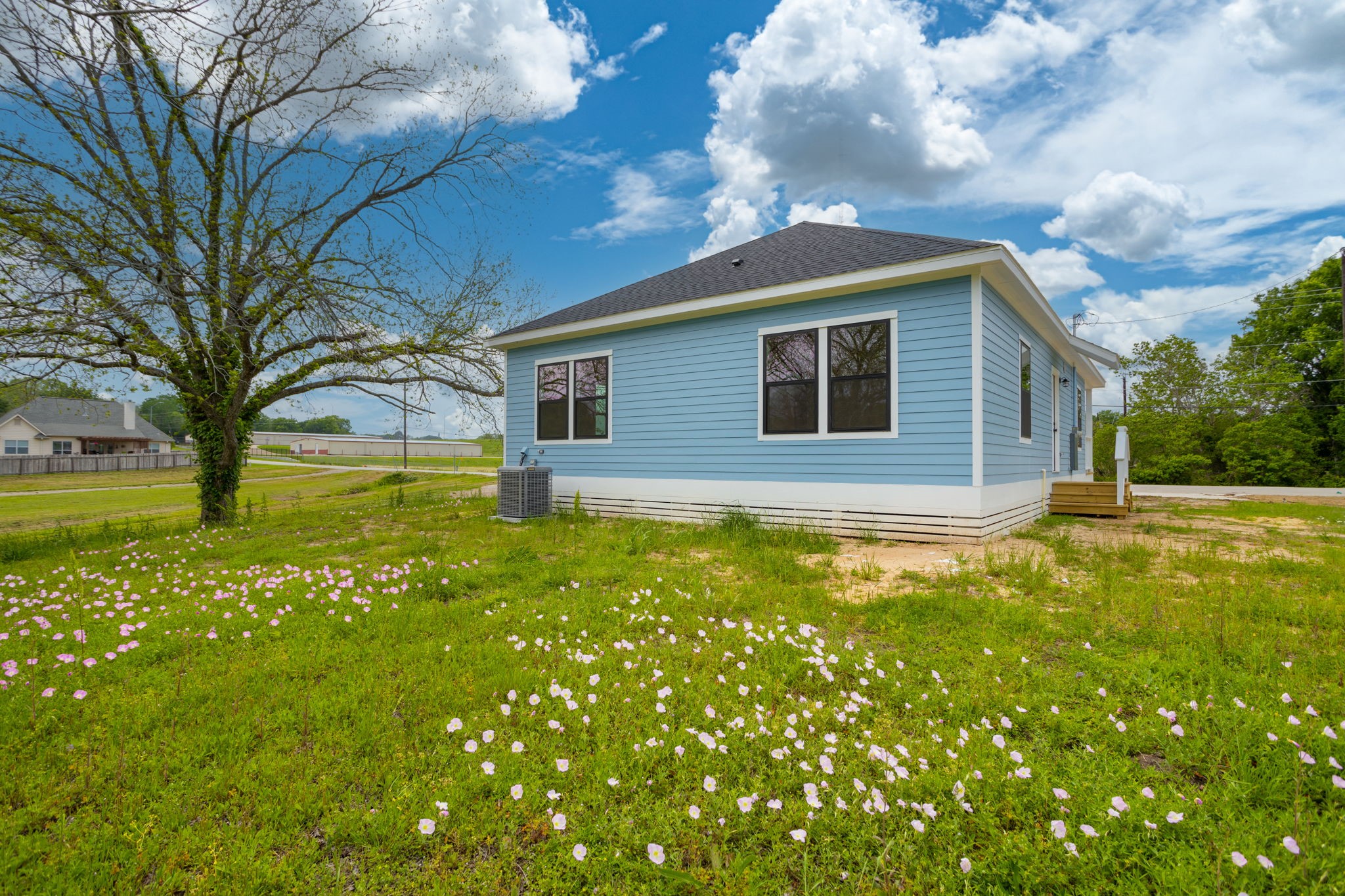 226 North Dixie Street Brenham, TX 77833 - Photo 22 of 22 a backyard of a house with lots of green space