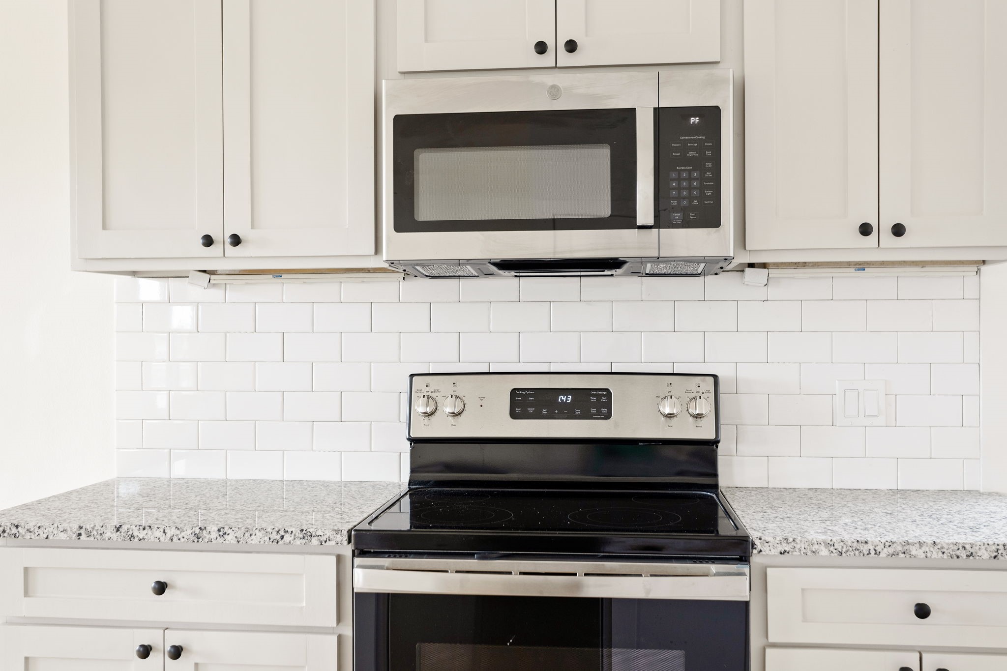 226 North Dixie Street Brenham, TX 77833 - Photo 10 of 22 a stove top oven sitting inside of a kitchen