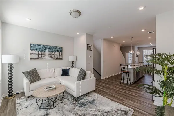 a living room with furniture and a rug