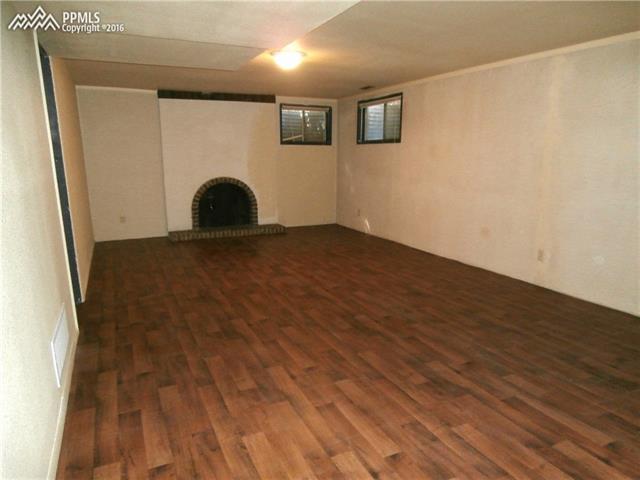 2870 Valencia Road Colorado Springs, CO 80917 - Photo 16 of 20 Possible 2nd family room in basement with engineered wood floors