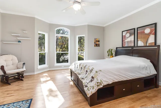 a spacious bedroom with a large bed and a window