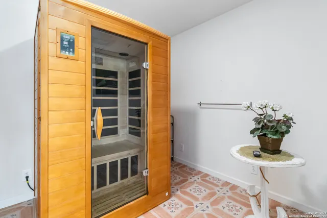 a front view of a house with a potted plant