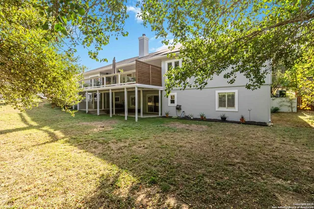 a house with trees in the background