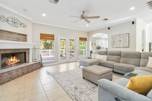 a living room with furniture and a fireplace